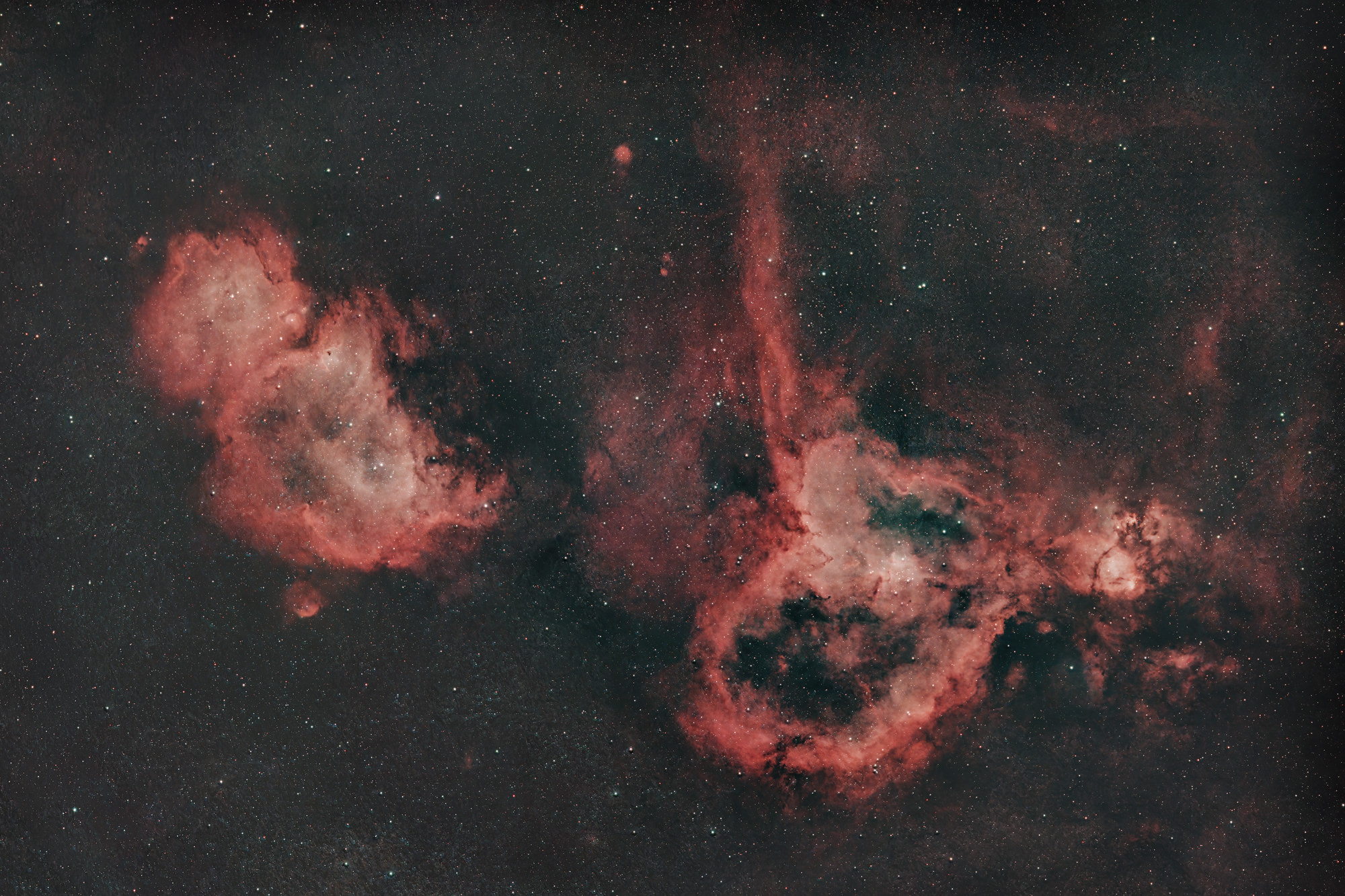 The Heart Nebula IC 1805 and the Soul Nebula IC 1848 are approximately 7,500 light-years from Earth. The two nebulae are located in the constellation Cassiopeia.